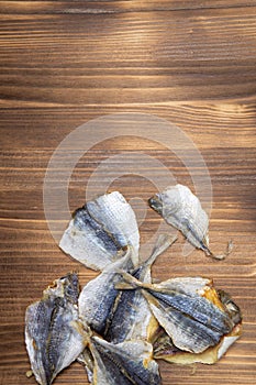 Salted fish lying on a wooden table