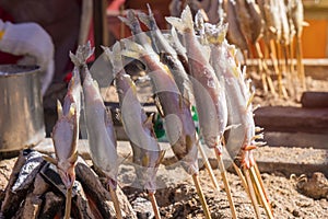 Salted grilled fish on the grill in market