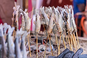 Salted grilled fish on the grill in market