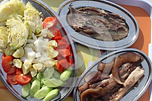 Salted herring fish and sardine. Green, cook and salad