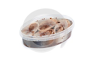 Salted herrings in a plastic pot