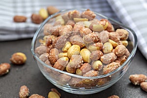 Salted peanuts in a glass bowl