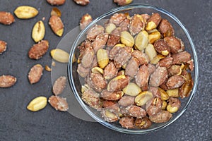 Salted peanuts in a glass bowl