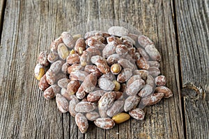 Salted peanuts on wood floor. bulk peanut kernels