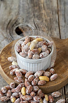 Salted peanuts on wood floor. bulk peanut kernels