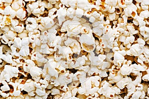 Salted popcorn background or texture, close-up, top view