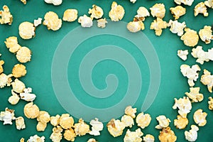 Salted popcorn mix with cheese popcorn frame on green paper background, have copyspace for put textSalted popcorn mix with cheese