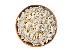 Salted popcorn in a wooden plate. Isolated on white background