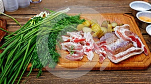 Salted pork lard salo with onion on a wooden board