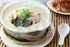 Salted and preserved egg chicken floss congee photo