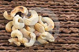 Salted cashews - Wooden background. Anacardium occidentale photo