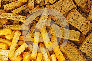 Salted rye and wheat bread crusts background