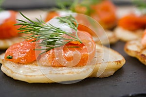 Salted salmon with dill on a pancake