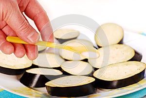 Salting slices of aubergine photo