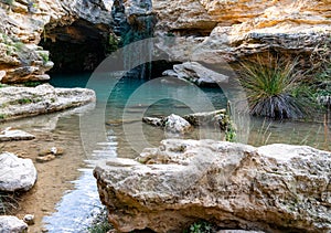 The Salto del Usero nature reserve with eroded sandstone cliffs and colorful pools of water