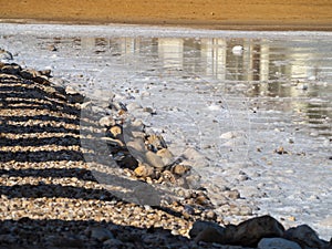 Salty beach at Ein Bokek Dead Sea Resort, Israel