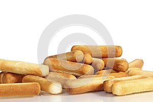 Salty bread sticks on white background