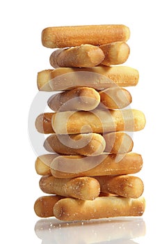 Salty bread sticks on white background