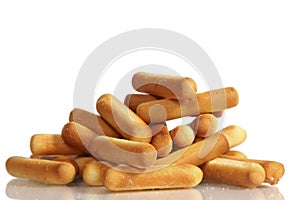Salty bread sticks on white background