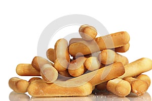 Salty bread sticks on white background