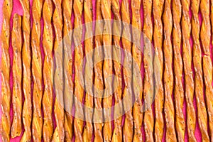 Salty breadsticks snack background pattern