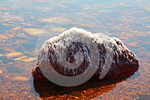 Salty Stones at Dead sea shore, hot day afternoon, Jordan