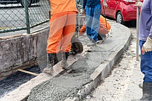 Salvador, Bahia, Brazil - August 11, 2023: Construction workers are making repairs to a pavementon Avenida Tancredo Neves photo