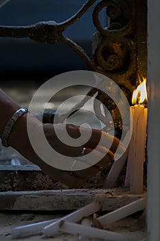 Salvador, Bahia, Brazil - November 02, 2015: People lighting candles in honor of the Day of the Dead