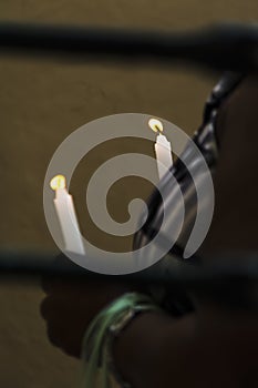 Salvador, Bahia, Brazil - November 02, 2015: People lighting candles in honor of the Day of the Dead