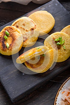 Salvadoran pupusa served with curtido  on board. view from above