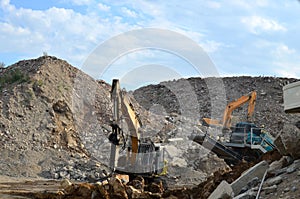 Salvaging and recycling building and construction materials. Excavator with hydraulic hammer work