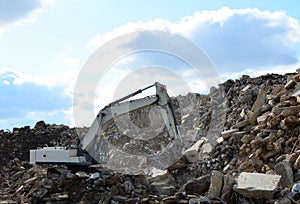 Salvaging and recycling building and construction materials. Industrial waste treatment plant.