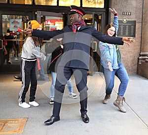 Salvation Army soldier performs for collections in midtown Manhattan.