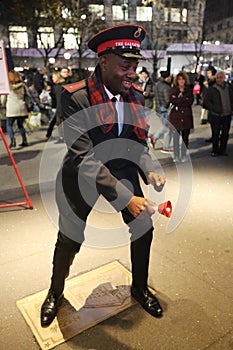 Salvation Army soldier performs for collections in midtown Manhattan.