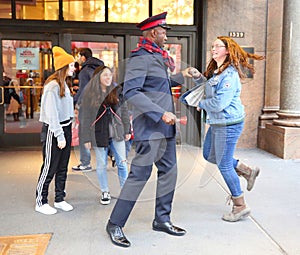 Salvation Army soldier performs for collections in midtown Manhattan.