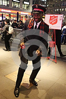 Salvation Army soldier performs for collections in midtown Manhattan.