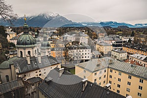 Salzburg Austria European medieval city street from above in December winter time with cathedral and living buildings foreground