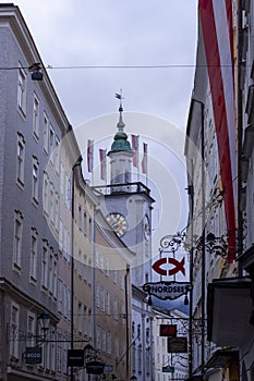 Famous historical street Getreidegasse with multiple advertising signs. Salzburg old town was listed as a UNESCO World Heritage