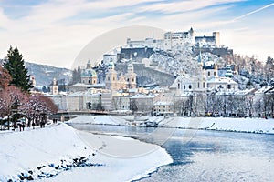 Salzburg skyline with Festung Hohensalzburg and river Salzach in winter, Salzburger Land, Austria photo