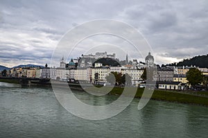 Salzburg skyline with Festung Hohensalzburg and Salzach river in autumn