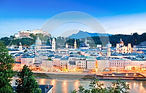 Salzburg skyline with river Salzach at dusk, Salzburger Land, Austria