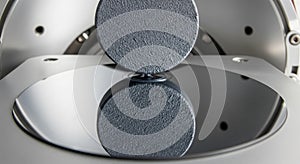 Samarium cobalt is sputtered onto a wafer surface to alter reflection quality in a controlled process