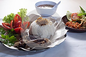 Sambal Iga Bakar or grilled ribs rice with spicy sauce