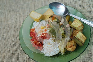 Sambal, sayur asem,tahu kulit dan terong goreng. Makanan khas indonesia photo