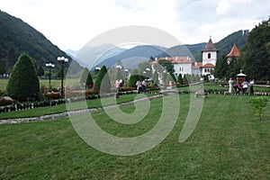 Sambata de Sus Monastery in Romania, with Carpathians mountains in the background