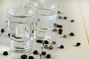 Sambuca in shot glasses and coffee beans