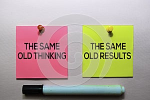 The Same Old Thinking and The Same Old Results text on sticky notes isolated on office desk