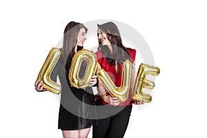 Same sex love concept. Two beautiful females women girls from lgbt community with long gorgeous hair on February 14th Happy valent