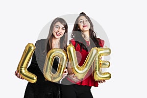 Same sex love concept. Two beautiful females women girls from lgbt community with long gorgeous hair on February 14th Happy valent