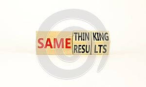 Same thinking and result symbol. Concept words Same thinking same results on wooden cubes. Beautiful white background. Businessman